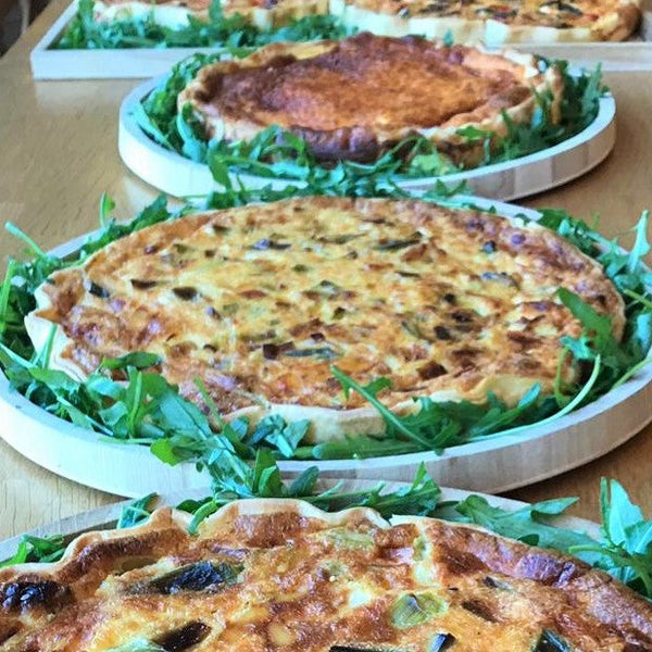 Homemade quiche served with side salad